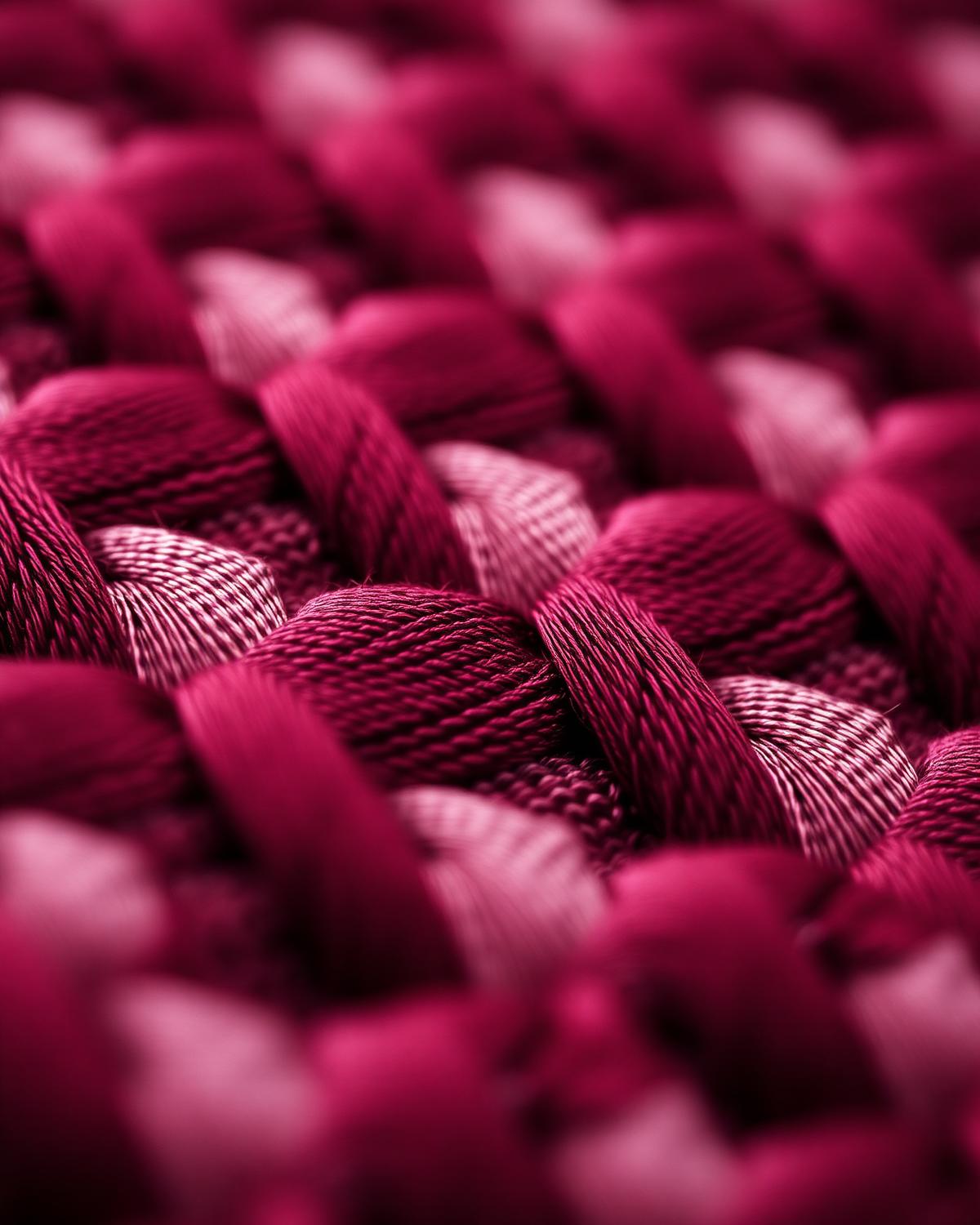 Closeup of wine-coloured woven fabric